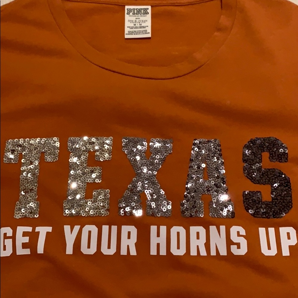 Victoria’s Secret T-shirt in the size Medium.